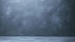 © Jeannaa - A plain, empty gray surface and wall, resembling a chalkboard or studio background with subtle texture.