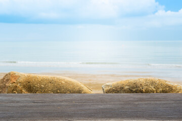 Fototapete - Wood floor counter top There is a view of sea in the background of the resort. A blurry beach and sky is visible. of decorative design ideas	