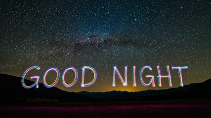 Wall Mural - glowing inscription 'good night' against the starry sky. light painting of celestial greetings. mess