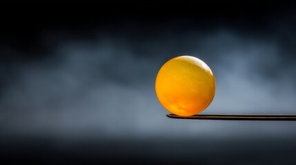 Aufkleber - A glowing orb is skillfully held between metallic tweezers, appearing to float in mid-air against a dark misty backdrop illuminated by mystical light