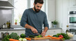 © Vasiliy - Man chopping fresh vegetables on wooden board in modern white kitchen with natural light. Healthy meal preparation for nutritious home cooking and balanced diet planning