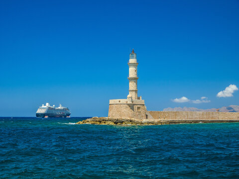 Old lighthouse built at the end of breakwater (Chania, Crete, Greece)