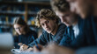 © Frenza - diverse students studying together at a large table in a modern library