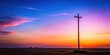 © Kitiphong - A lone electric pole stands against a serene purple-blue sky at sunset, set against a gentle gradient of warm hues as day gives way to night, silhouette, rural