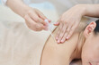 © Dialogue Frame - Female Shoulder Oil Massage Therapy for Relaxation at Spa