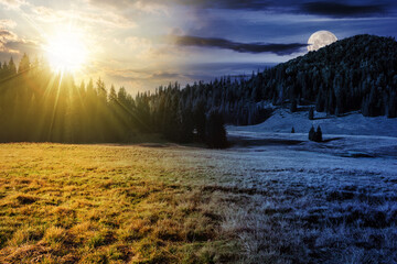 Wall Mural - hillside of mountain range with coniferous forest and meadow with sun and moon at twilight. day and 