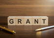 © Pixel Studio - Grant funding application process business finance opportunity wooden blocks grant writing tips