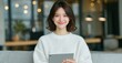 © Georgy - A woman on a sofa engages in accounting, budget review, and bookkeeping on her tablet, utilizing her laptop and remote work setup for a happy freelancing experience with technology and internet-based