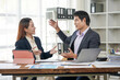 © Kritdanai - Business Professionals Collaborating in Office