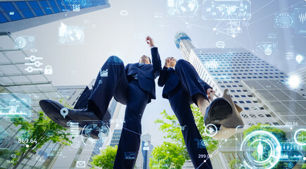 Fototapete - Jumping male and female business people and digital technology concept