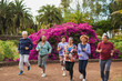 © Sabrina - Happy senior people running together at city park - Group of elderly multiracial friends doing sport outdoor - Healthy lifestyle and support concept