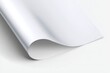 © AuraArt - Close-up of a sheet of white paper, gently curved, showcasing its texture and subtle shadows.