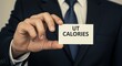 © singgih - Calories on Card Held by Person