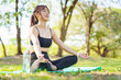 © DG PhotoStock - Asian woman practicing yoga and meditation under a big tree in the park during a peaceful morning.