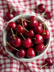 Aufkleber - Bright Red Cherries in a Bowl Resting on Gingham Cloth, Capturing the Essence of Summer Freshness and Simple Pleasure in a Bright Kitchen Setting