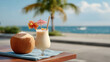 © AllieGraphix - A tropical pina colada served in a fresh coconut, styled with a straw and tiny umbrella, set against a clear blue sky at the beach.