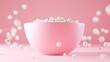 © Bassmallah - Pink bowl filled with white pearls on pink background.