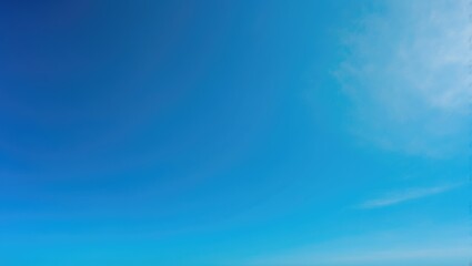 Wall Mural - Sunlit summer scene showcasing a vibrant, clear blue sky with abstract cloud patterns