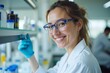© Vera - Close-Up Portrait of a Female Biochemist beaming with Professionalism and Joy in her Laboratory Work