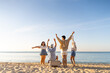 © CandyRetriever  - Happy Asian man and woman travel the sea on summer beach holiday vacation. Group of People friends enjoy and fun outdoor lifestyle holding cooler box walking to picnic on tropical beach in sunny day.