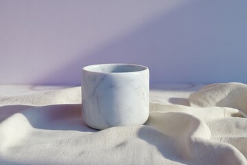 Poster - A round, white marble-patterned ceramic decorative cup.