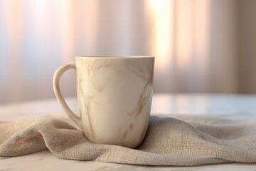 Poster - Creamy marble mug resting on a linen cloth.