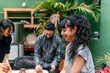 © Centric  - Three artisans collaborating in a pottery workshop, skillfully molding clay and crafting unique ceramics with creativity and passion
