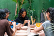© Centric  - Group of Latin women engaged in creating handmade ceramic pieces during an inspiring pottery workshop, fostering creativity and community