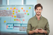 © WavebreakMediaMicro - Whiteboard displaying colorful sticky notes, diagrams in office space showing brainstorming session
