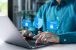 © Thapana_Studio - Cybersecurity concept with businessman using a laptop to protect data folders and digital files. Represents data privacy, secure information, and advanced cyber protection.