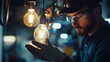 © Velem - Industrial Worker Inspecting a Light Bulb