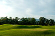 © redbeach - Scenic View of a Lush Green Golf Course – Manicured Fairways and Natural Landscape