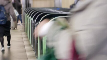 Canvas Print - Close up view of the ticket gate in the train station with many passenger get through the ticket gate in rush hour