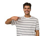 © Asier - Young handsome caucasian man isolated on white background person pointing by hand to a shirt copy space, proud and confident