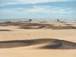 © Igor - After the storm, sand dunes. Beautiful natural phenomenon. Dune landscape. Sandy shore. Sunny day. People walking.