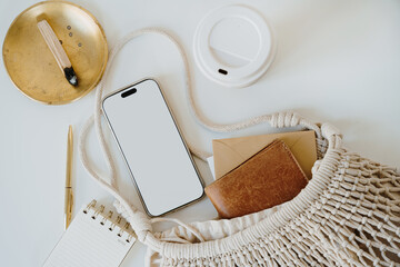 Wall Mural - Modern Smartphone and Notebook Arranged with Cotton Bag in Soft Natural Style