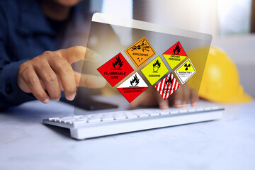 Wall Mural - dangerous substance concept with freight forwarders staff working to classify dangerous goods and fl