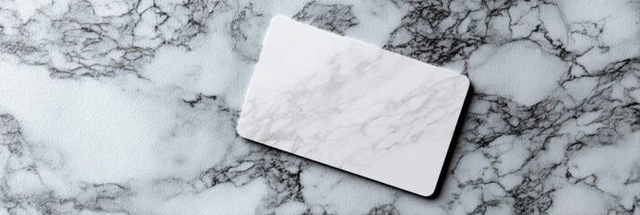 Poster - Elegant Gift Card Mockup on a White Marble Surface With Ample Space for Branding and Personalization