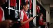 © peopleimages.com - Rest, soccer and woman with phone in locker room for social media, contact and communication for game. Athlete, football and person typing on smartphone for match, training and tournament schedule