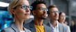 © Sonthana - business office innovation concept. Professional group of diverse individuals in glasses, focused on a presentation or discussion.
