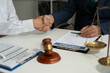 © NINENII - Middle age partner lawyers attorneys shaking hands after discussing a contract agreement done..