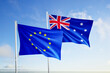 © mustapha - flags of european union and australia over blue sky background.