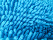 © SolaruS - Abstract closeup of a textured blue microfiber cloth or mat. Soft, absorbent material for cleaning, bath, or home decor. Illustrates comfort, hygiene, and cleanliness.