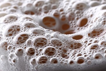 Aufkleber - Close-up view of soap bubbles creating a textured foam pattern in a soft light setting