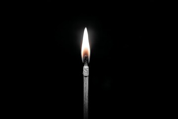 Aufkleber - Flame burning brightly from a matchstick in a dark environment at nighttime