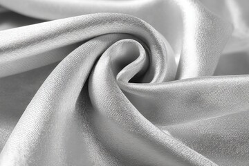 Leinwandbilder - Silky fabric in a twist showcasing smooth texture and sheen in natural light