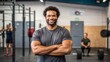 © DND - Happy, fit man with arms crossed in gym, confident and strong