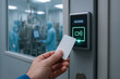 © newlifestock - Access control card being used to enter vaccine production facility with workers in protective suits visible inside cleanroom environment