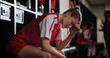 © peopleimages.com - Frustrated girl, soccer player or mistake with stress in locker room for loss, pain or headache. Female person, sport or migraine with sore ache, fatigue or burnout for bad game, defeat or depression