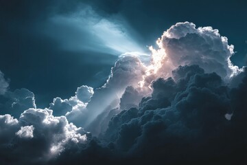 Poster - Dramatic clouds with rays of light illuminating the sky at dawn over a peaceful landscape